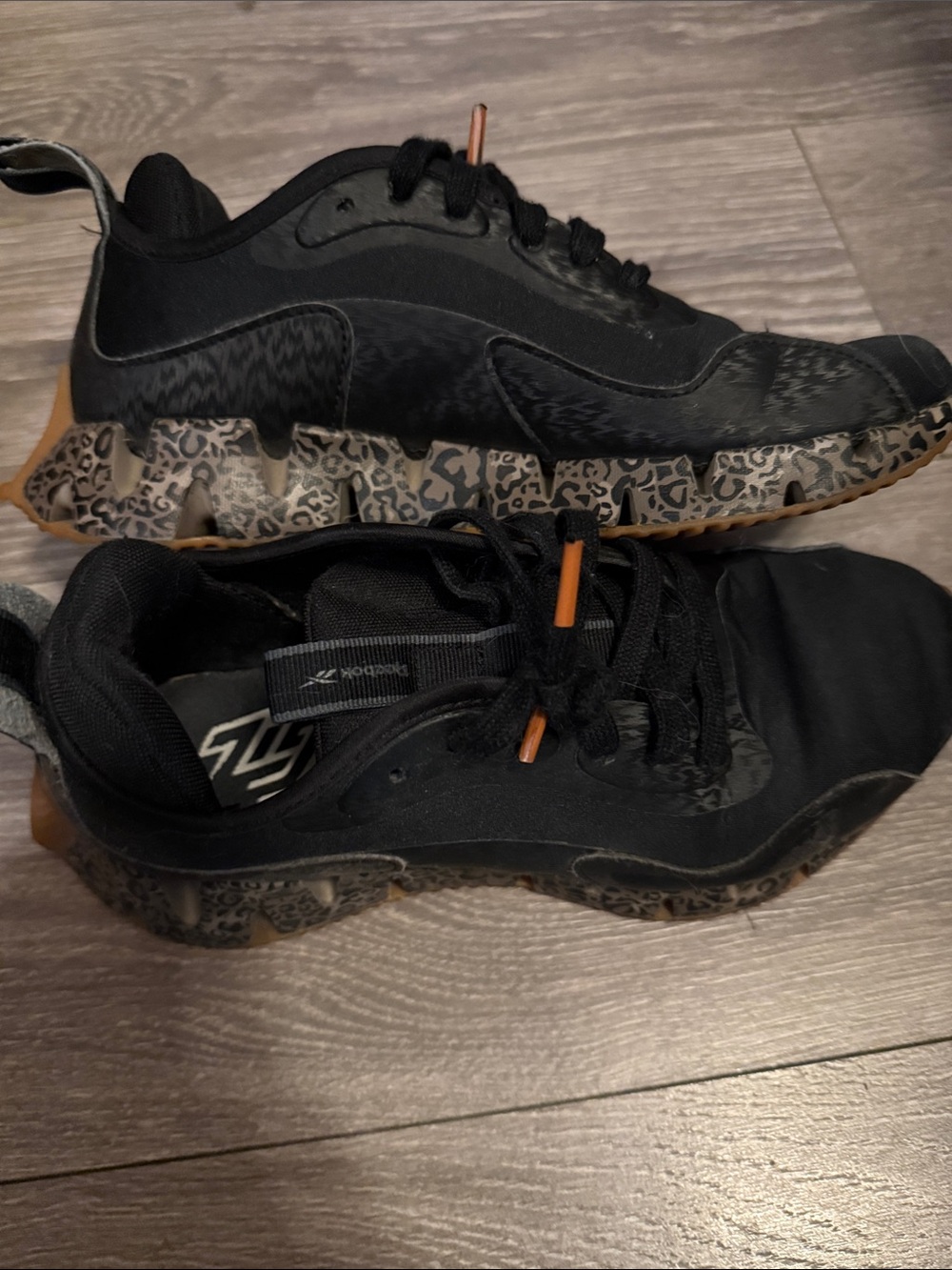 Rebook Black Athletic Sneakers with Cheetah Patterned Sole